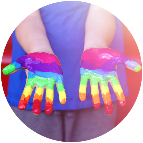 hand with different colors of paint on the fingers